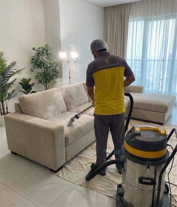 123 Our professional team uses a steam vacuum to restore a fabric sofa, delivering a spotless finish for a cleaner home.