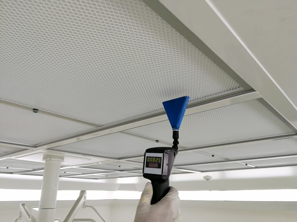 Technician measuring particulate matter for indoor air quality testing in Dubai.