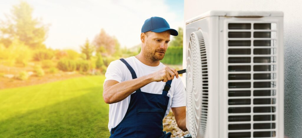 Technician working on house air conditioning or outdoor unit to determine can AC compressor be repaired, by Adams Care