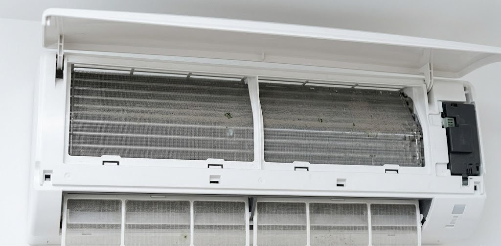 An air conditioning unit showing signs of mould growth.